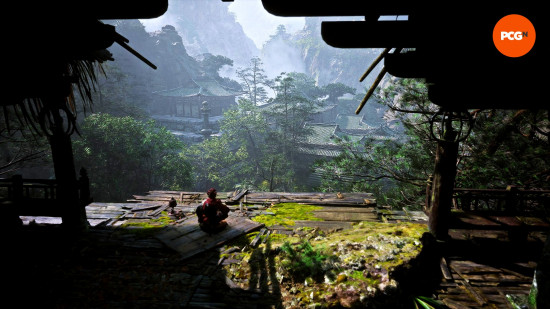 Black Myth Wukong review: The Destined One sits at a meditation spot and takes in the lush forests and pastoral villages of Black Wind Mountain.